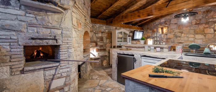 Casa Di Roccia holiday house outside kitchen and lounge area.